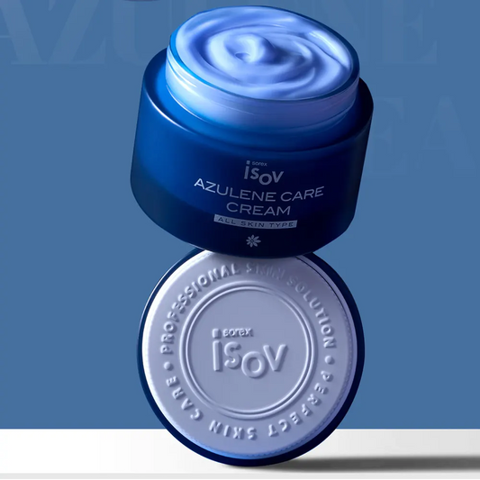 A blue cosmetic cream jar 'Isov Azulene Care Cream' with its lid placed below