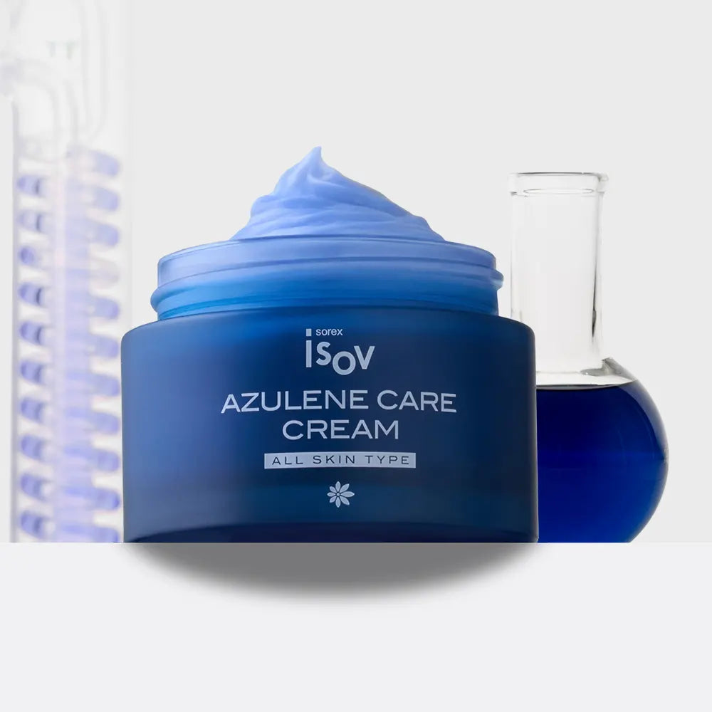 A blue cosmetic cream jar labeled 'ISOV AZULENE CARE CREAM' with a swirled blue lid