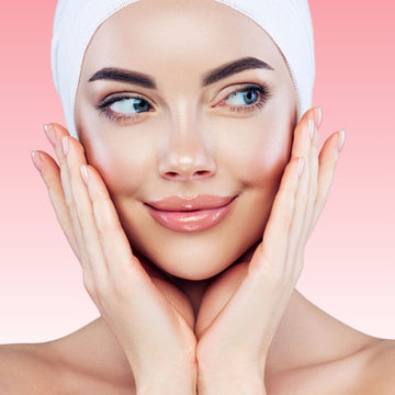 Smiling woman with flawless, glowing skin after successful skincare treatments.