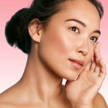 Young woman with an even, blemish-free skin tone, showing the effects of consistent skincare care.